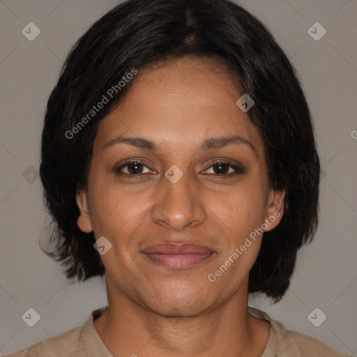 Joyful black adult female with medium  brown hair and brown eyes