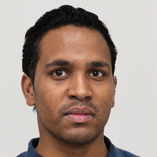Neutral black young-adult male with short  black hair and brown eyes