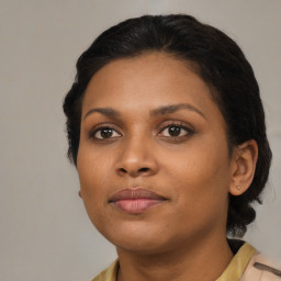 Neutral black young-adult female with medium  black hair and brown eyes