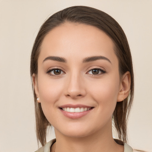 Joyful white young-adult female with long  brown hair and brown eyes