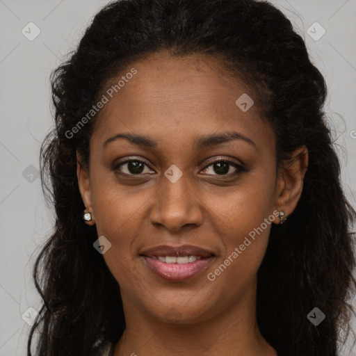 Joyful black young-adult female with long  brown hair and brown eyes