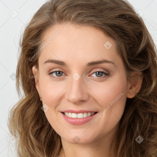 Joyful white young-adult female with long  brown hair and green eyes