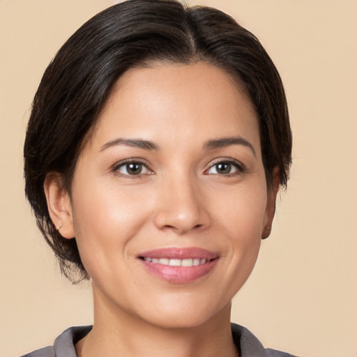 Joyful white young-adult female with medium  brown hair and brown eyes