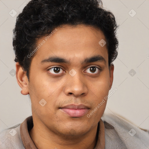 Joyful latino young-adult male with short  brown hair and brown eyes