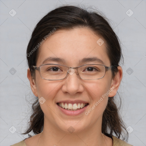 Joyful white adult female with medium  brown hair and brown eyes