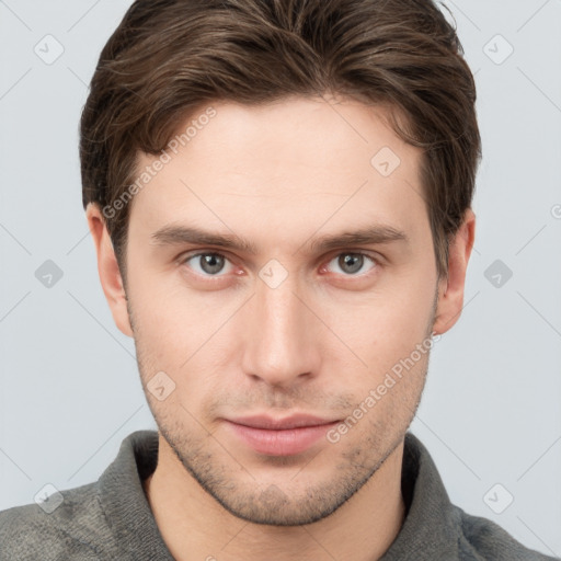 Neutral white young-adult male with short  brown hair and grey eyes