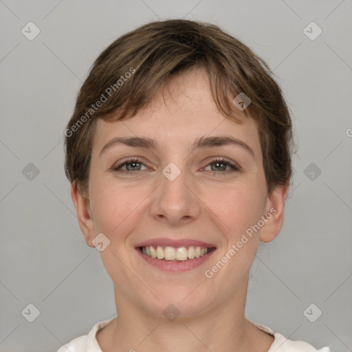 Joyful white young-adult female with short  brown hair and grey eyes