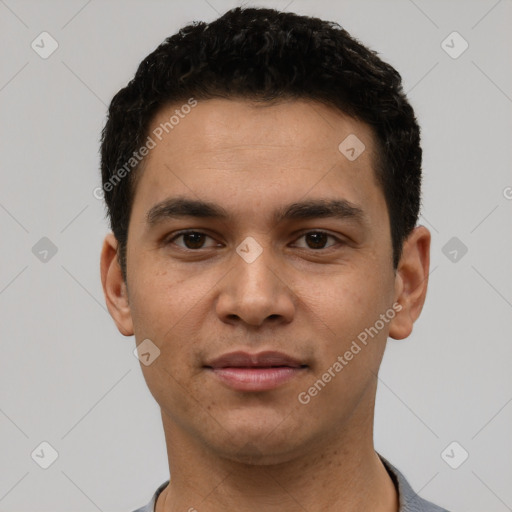 Joyful white young-adult male with short  black hair and brown eyes