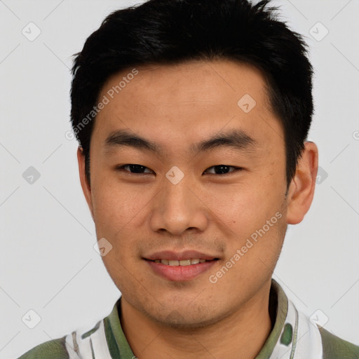 Joyful asian young-adult male with short  black hair and brown eyes