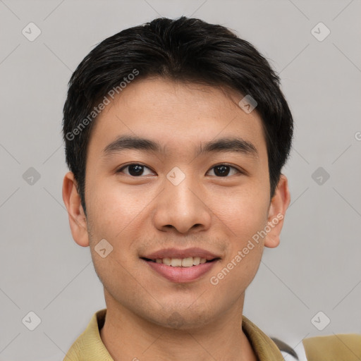 Joyful asian young-adult male with short  brown hair and brown eyes