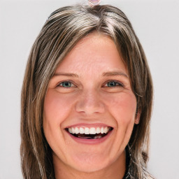 Joyful white young-adult female with long  brown hair and blue eyes