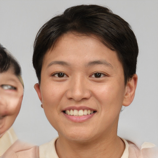Joyful white young-adult female with short  brown hair and brown eyes