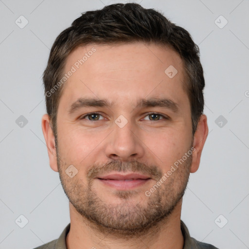 Joyful white adult male with short  brown hair and brown eyes