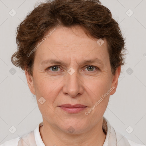 Joyful white adult female with short  brown hair and brown eyes