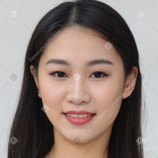 Joyful asian young-adult female with long  brown hair and brown eyes