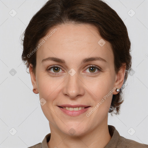 Joyful white adult female with short  brown hair and grey eyes