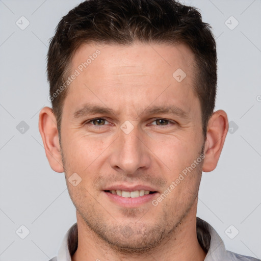 Joyful white adult male with short  brown hair and brown eyes