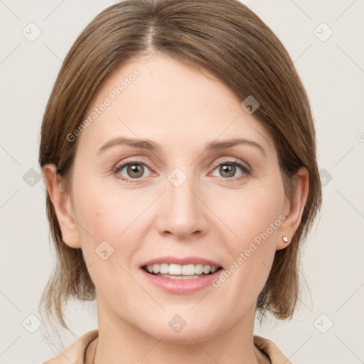 Joyful white young-adult female with medium  brown hair and grey eyes