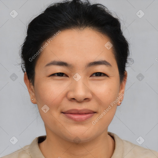 Joyful asian young-adult female with short  brown hair and brown eyes