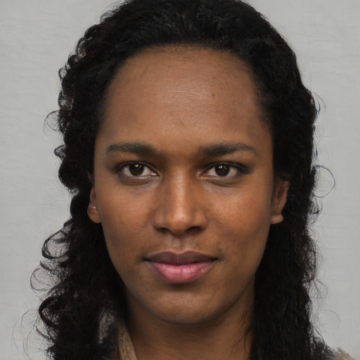 Neutral black young-adult female with long  black hair and brown eyes