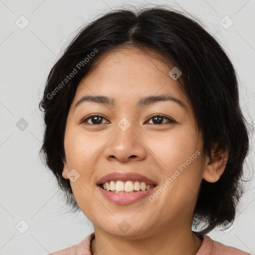 Joyful asian young-adult female with medium  brown hair and brown eyes