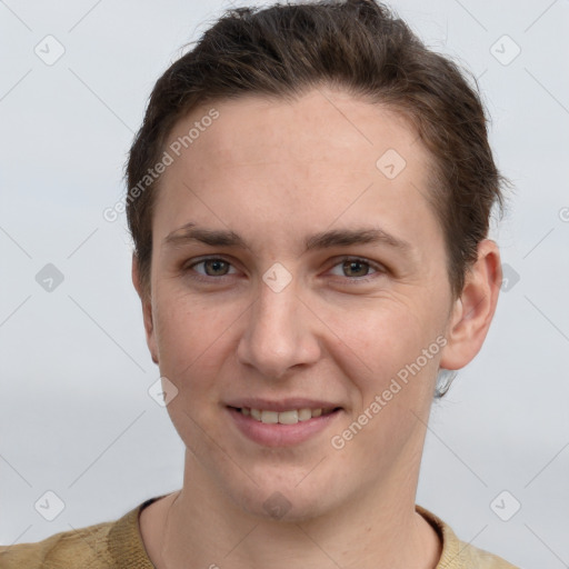 Joyful white young-adult female with short  brown hair and grey eyes