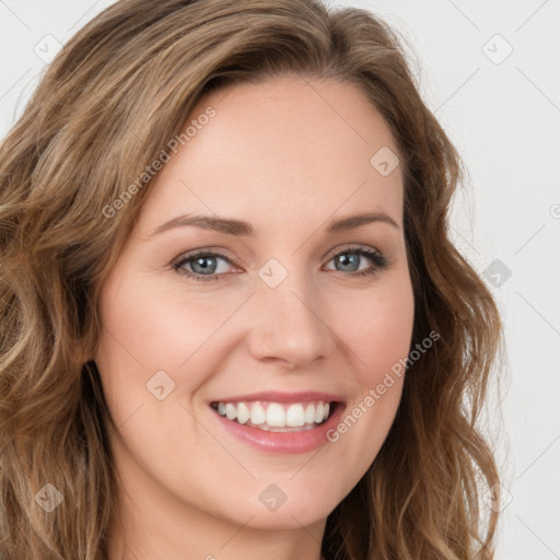 Joyful white young-adult female with long  brown hair and green eyes