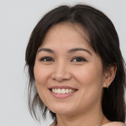 Joyful white adult female with medium  brown hair and brown eyes