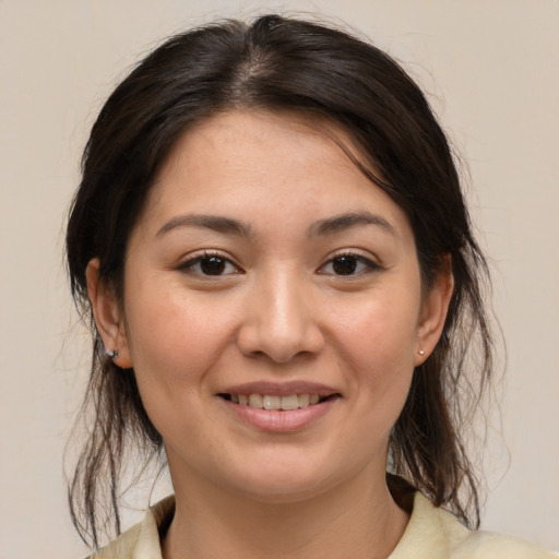 Joyful asian young-adult female with medium  brown hair and brown eyes