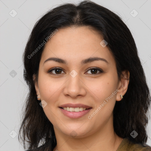 Joyful latino young-adult female with medium  brown hair and brown eyes