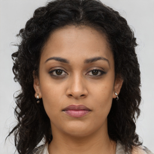 Neutral black young-adult female with long  brown hair and brown eyes