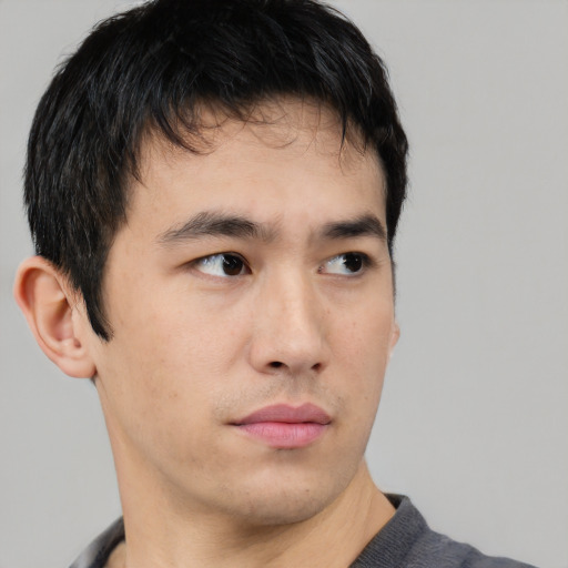 Neutral asian young-adult male with short  brown hair and brown eyes