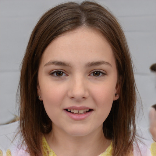 Joyful white child female with medium  brown hair and brown eyes