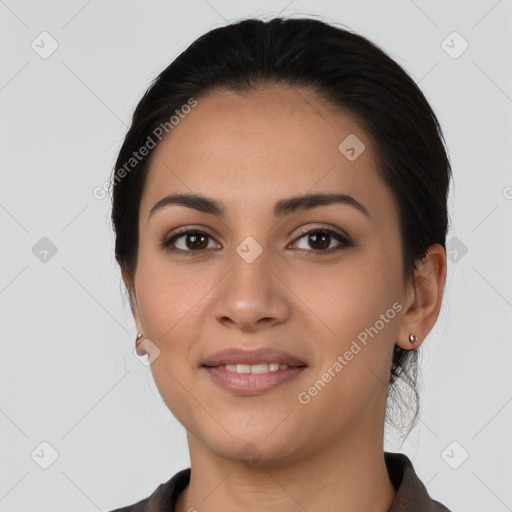 Joyful latino young-adult female with medium  black hair and brown eyes