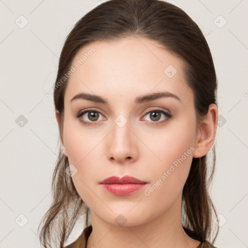 Neutral white young-adult female with long  brown hair and brown eyes