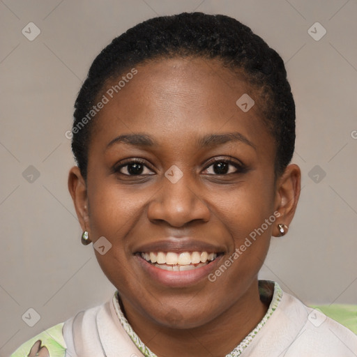 Joyful black young-adult female with short  black hair and brown eyes