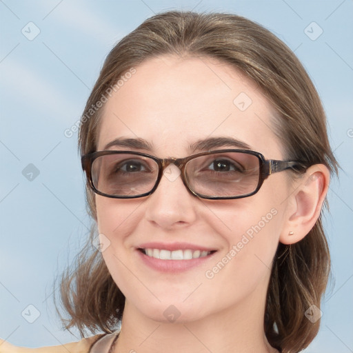 Joyful white young-adult female with medium  brown hair and blue eyes