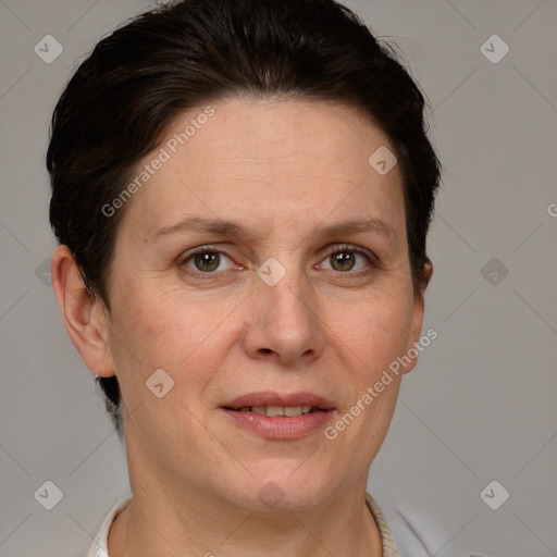 Joyful white adult female with short  brown hair and grey eyes