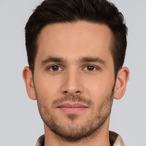 Joyful white young-adult male with short  brown hair and brown eyes