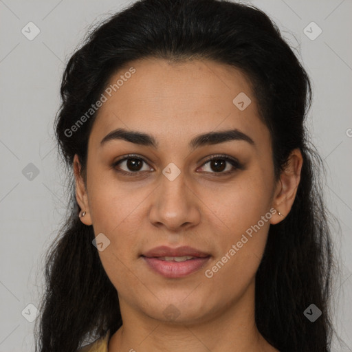 Joyful latino young-adult female with long  brown hair and brown eyes