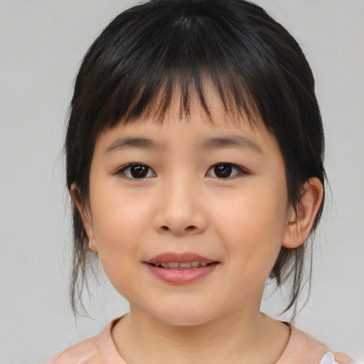 Joyful asian child female with medium  brown hair and brown eyes
