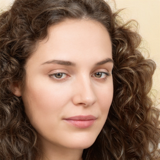 Neutral white young-adult female with long  brown hair and green eyes