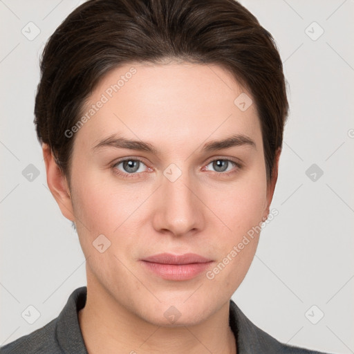 Joyful white young-adult female with short  brown hair and grey eyes