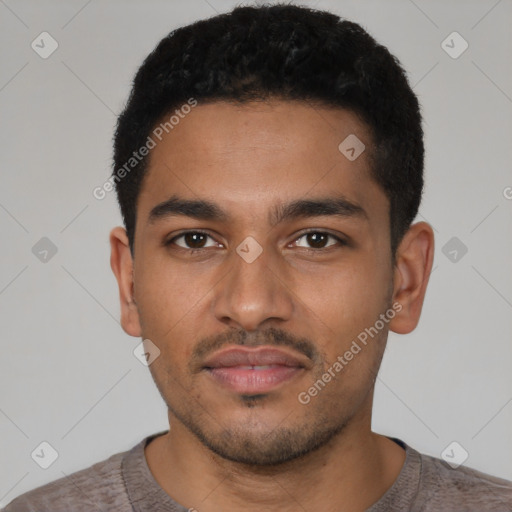 Neutral latino young-adult male with short  black hair and brown eyes