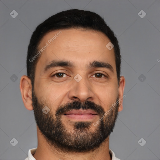 Joyful latino young-adult male with short  black hair and brown eyes