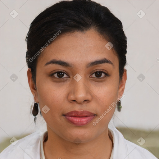 Joyful latino young-adult female with short  brown hair and brown eyes