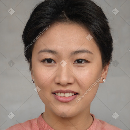 Joyful asian young-adult female with short  brown hair and brown eyes