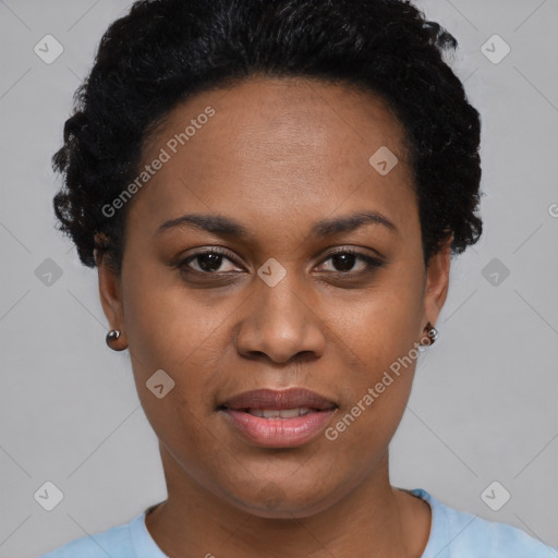 Joyful black young-adult female with short  black hair and brown eyes