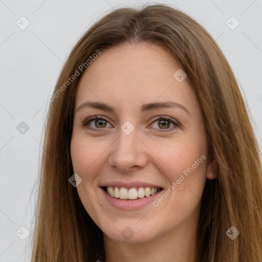 Joyful white young-adult female with long  brown hair and green eyes