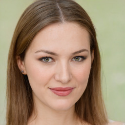 Joyful white young-adult female with long  brown hair and green eyes